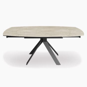 Uitschuifbare eettafel van Houweling Interieur. Uitschuiftafel met keramiek tafelblad en zwart metalen spinpoot.