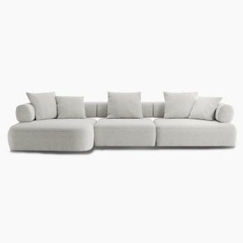 Modulaire bank van Olta bij Houweling Interieur. Het is een elementenbank met ronde vormen uitgevoerd in crèmekleurige stof.