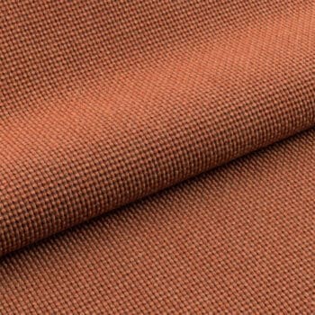Meubelstoffen bij Houweling Interieur. Atlas meubelstof van Ploeg stoffen, met geweven structuur en matte toon in bruinoranje kleur.