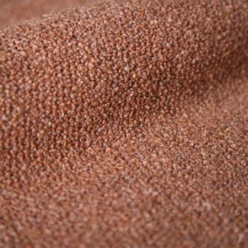 Meubelstoffen bij Houweling Interieur. Monza meubelstof van De Ploeg stoffen met wollige touch uitgevoerd in zalmkleur.