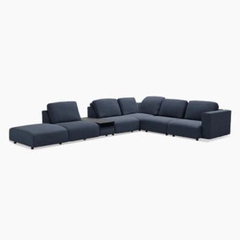 Modulaire hoekbank van Topform bij Houweling Interieur. Elementenbank met strakke lijnen en ronde vormen uitgevoerd in blauwe stof.