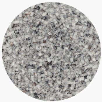 Rond vloerkleed bij Houweling Interieur van De Munk Carpets. Karpet uitgevoerd in grijstinten.