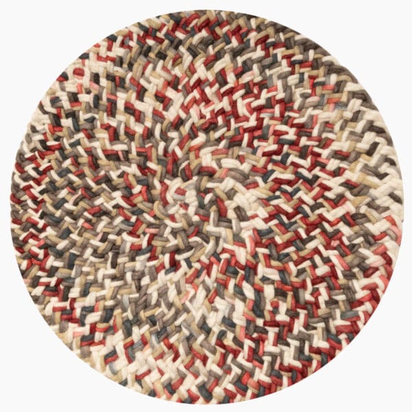 Rond vloerkleed bij Houweling Interieur van De Munk Carpets. Karpet uitgevoerd in crème-, groen- en roodtinten.