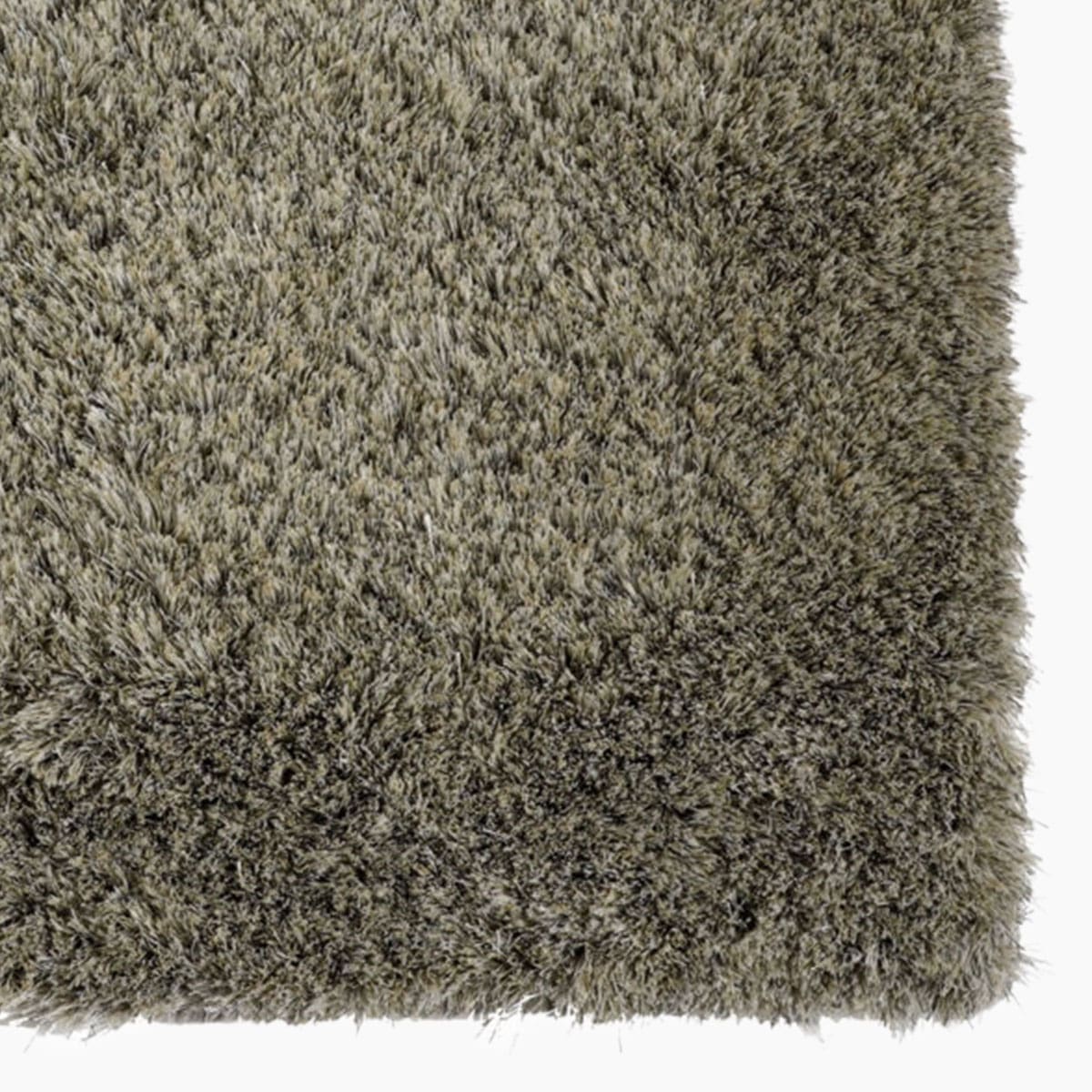 Modern vloerkleed bij Houweling Interieur van De Munk Carpets. Karpet uitgevoerd in groentinten.