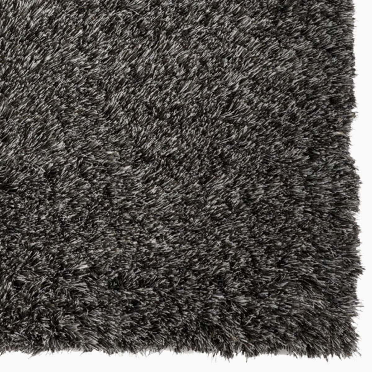 Modern vloerkleed bij Houweling Interieur van De Munk Carpets. Karpet uitgevoerd in bruin- en grijsttinten.