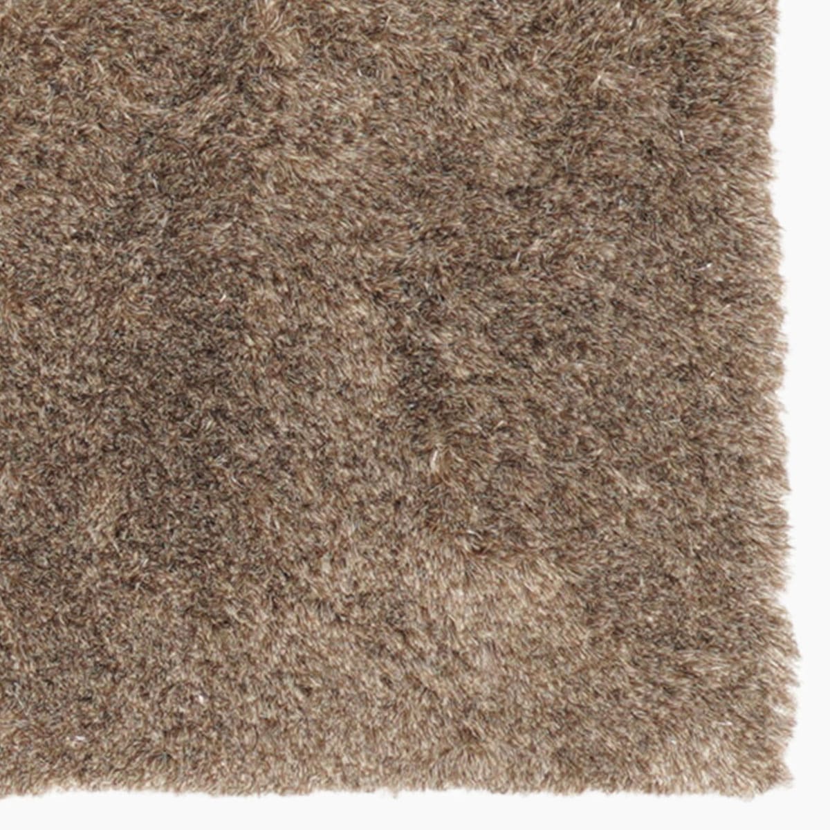 Modern vloerkleed bij Houweling Interieur van De Munk Carpets. Karpet uitgevoerd in beige.