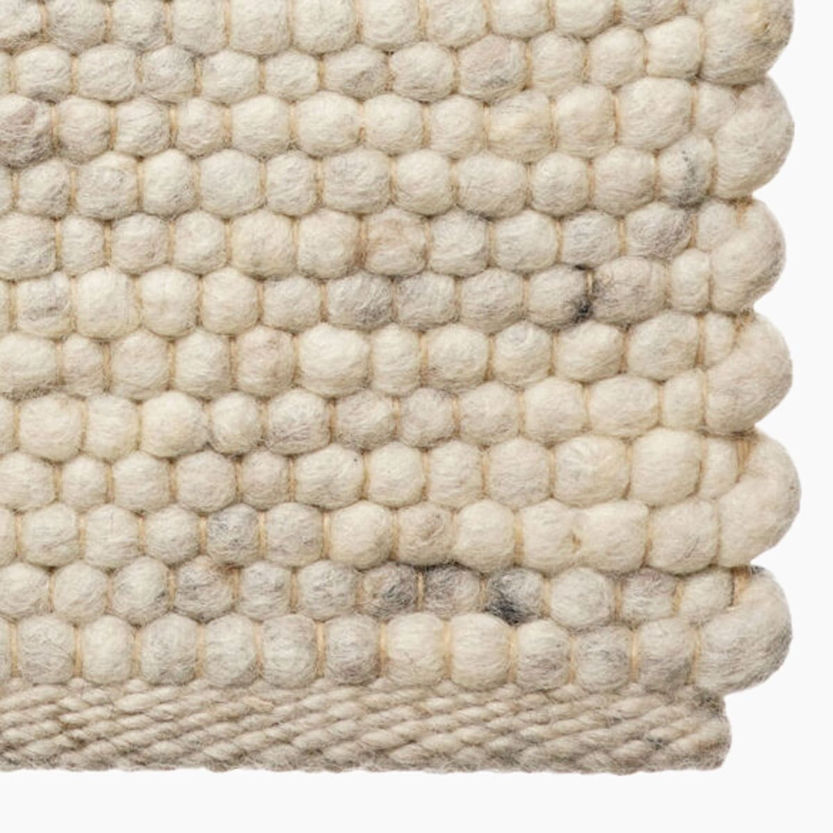 Wollen vloerkleed bij Houweling Interieur van De Munk Carpets. Karpet uitgevoerd in crème.
