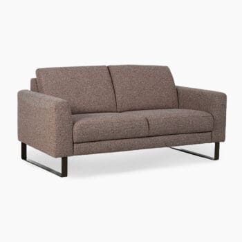 Relaxbank bij Houweling Interieur. Het is een design bank uitgevoerd in oudroze stof.